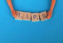 close up shot of scrabble tiles on a blue surface